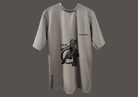 Model wearing black Trisholic oversized t-shirt with minimalist logo print" Caption: Keep it clean. The classic Trisholic tee in jet black is a wardrobe essential.