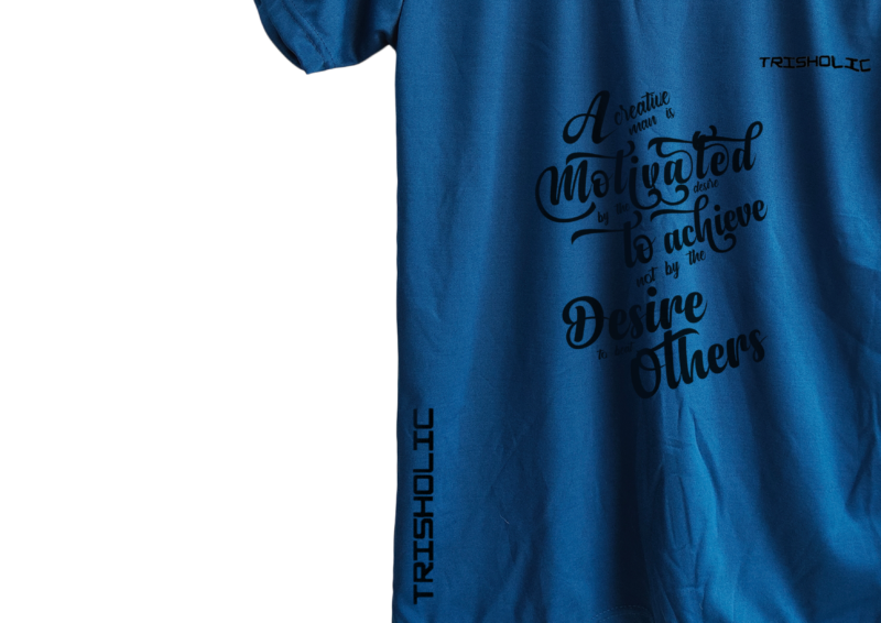 Black Trisholic t-shirt with bold white quote “Hustle Hard Stay Humble” across the chest.