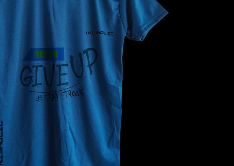 Model wearing matte blue Never Give Up printed t-shirt styled with jeans