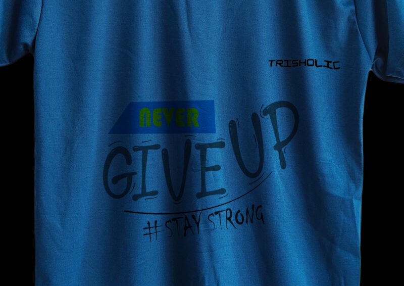 Person outdoors wearing matte blue Never Give Up printed t-shirt