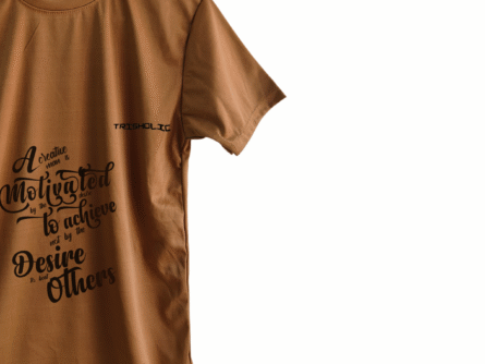 Heather gray Trisholic shirt with clean script reading “Mindset is Everything.”