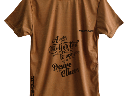 Trisholic t-shirt in light gray with the quote “Progress Not Perfection” in cursive and bold combo typography.