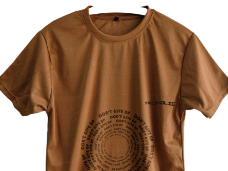 Trisholic t-shirt with the word “Be Relentless” in bold, uppercase type centered across the chest.