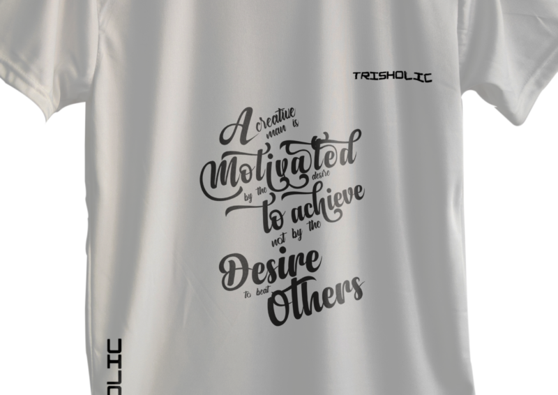 Black Trisholic t-shirt with bold white quote “Hustle Hard Stay Humble” across the chest.