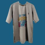 Flat lay of Be the Hero quote t-shirt by Trisholic