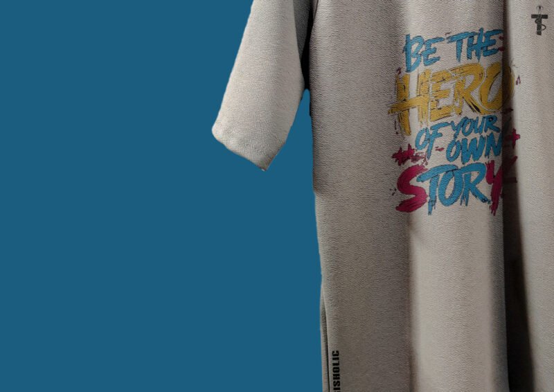 Close-up of Be the Hero quote on t-shirt