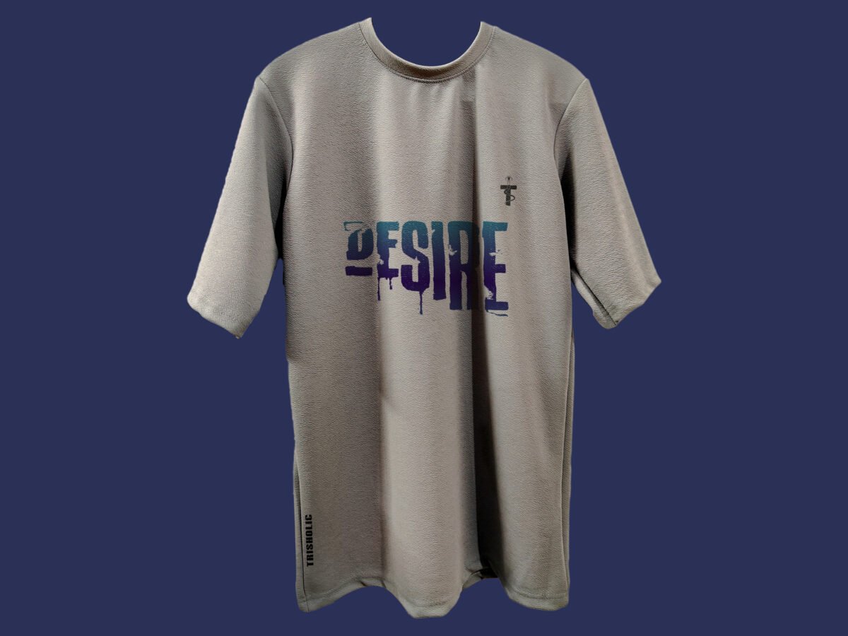 Model wearing oversized Trisholic tee with Desire quote