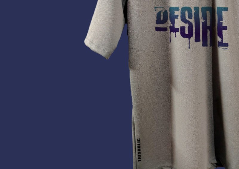 Flat lay of oversized Trisholic Desire quote t-shirt