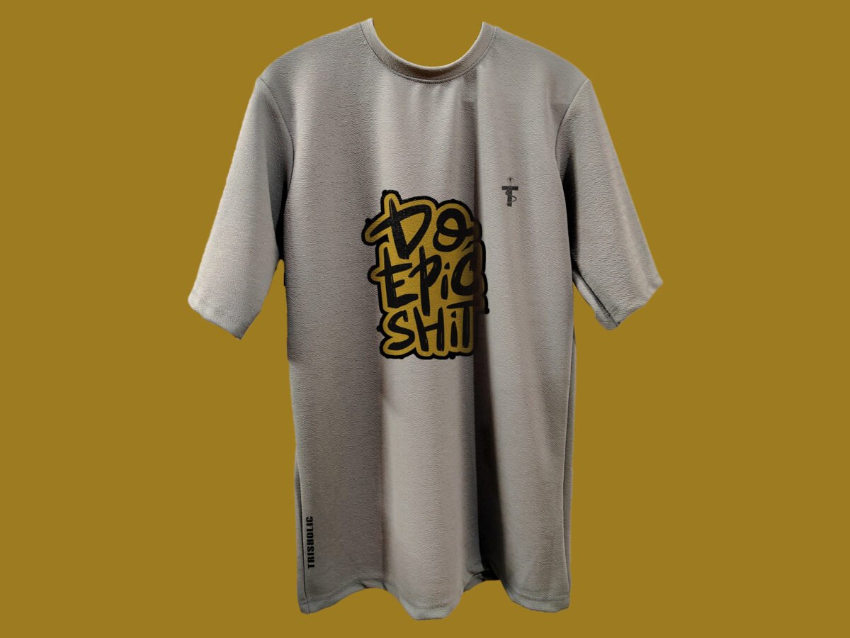 Model wearing oversized Trisholic tee with Do Epic Shit quote