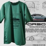 Close-up of Porsche car design on green tee