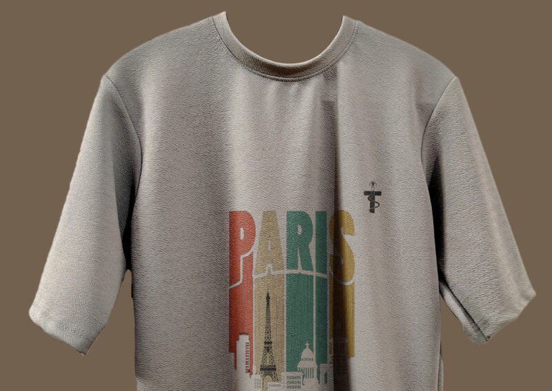 Folded Trisholic grey t-shirt with Paris print visible