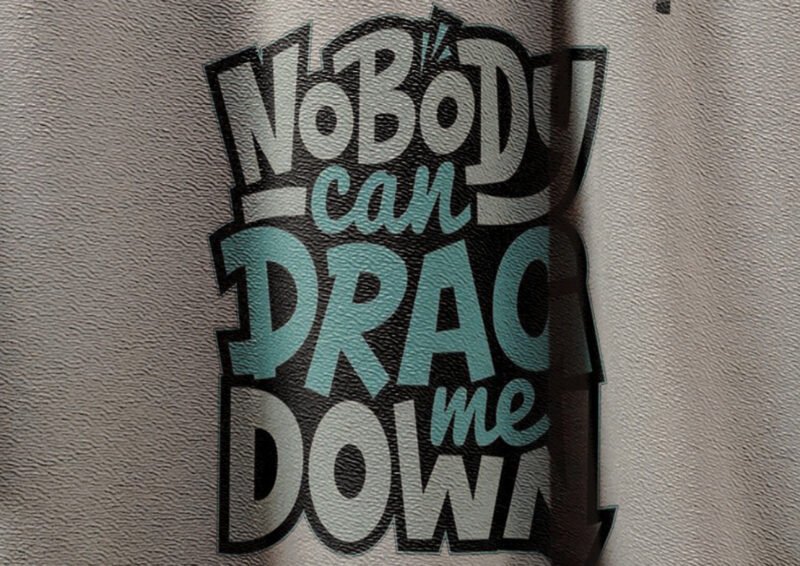 Close-up of Nobody Can Drag Me Down quote on t-shirt