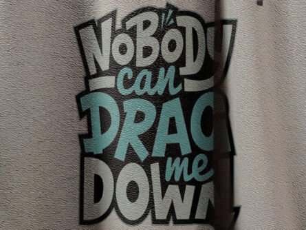 Close-up of Nobody Can Drag Me Down quote on t-shirt