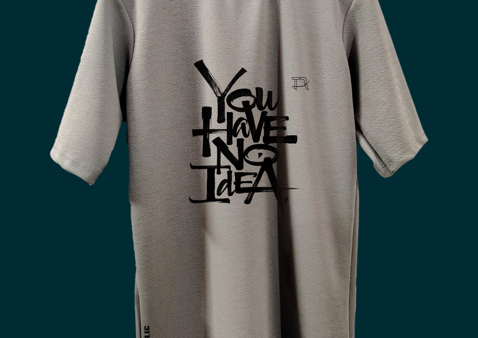 Flat Lay of Grey T-Shirt with Quote Visible