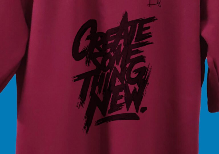 Flat Lay of Folded Red T-Shirt with Visible Quote