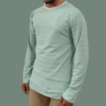 Trisholic sea green tee styled with black jeans and sneakers