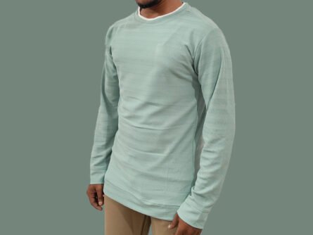Trisholic sea green tee styled with black jeans and sneakers