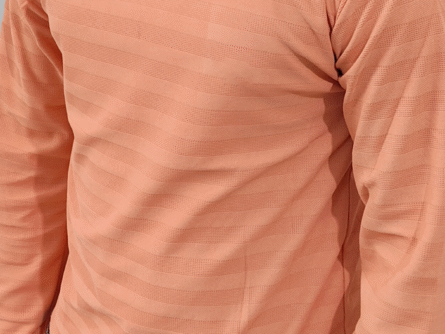 Fabric close-up of orange cotton blend t-shirt