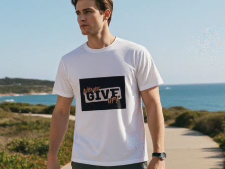 Flat lay of Men’s Never Give Up Motivational T-Shirt | White Slim Fit Tee – Trisholic styled with denim and accessories.